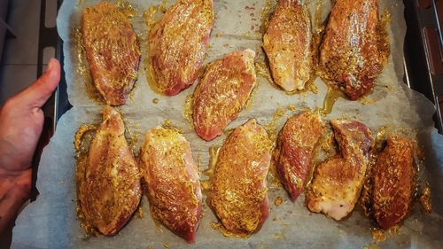 Directly above shot of marinated chicken in tray