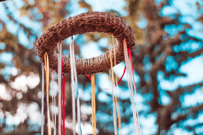 Close-up of heart shape hanging on rope