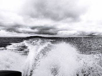 Scenic view of sea against cloudy sky