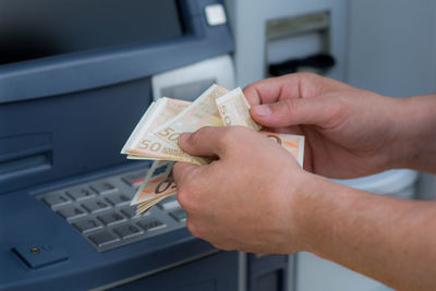 Close-up of hand holding camera