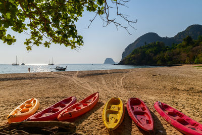 Landscape of farang beach or charlie beach, there are canoes on the sandy beach 