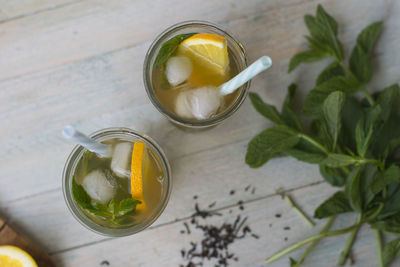 Top view of lemon iced tea with mint leaves