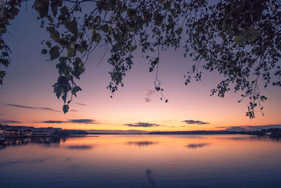 Scenic view of lake against sky during sunset