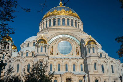 Low angle view of building against blue sky