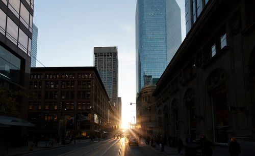 City street amidst buildings against sky