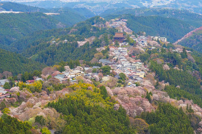 High angle view of townscape and mountains