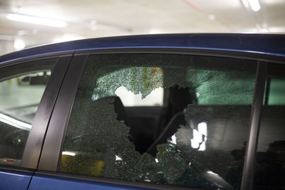 Close-up of broken glass window