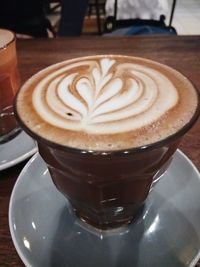 High angle view of cappuccino on table