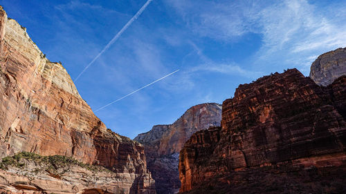 Low angle view of rocks against sky