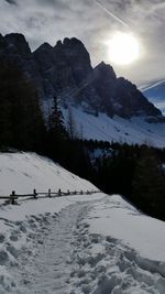 Scenic view of snow covered mountains against sky