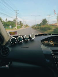 Close-up of car moving on road