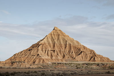 Imposing mountain of sand in the middle of the desert