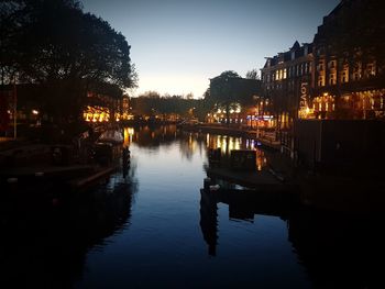 Canal in city at night