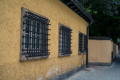 Low angle view of windows on wall of building