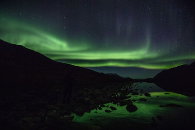 Scenic view of mountain against sky at night