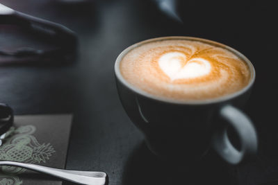 Close-up of cappuccino on table