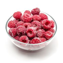 Close-up of red berries on white background