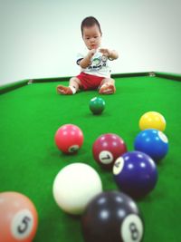 Full length of boy playing with ball