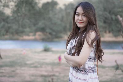 Portrait of beautiful woman standing in water