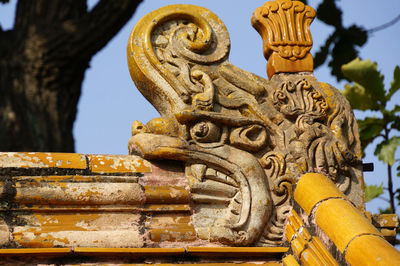 Low angle view of statue against sky