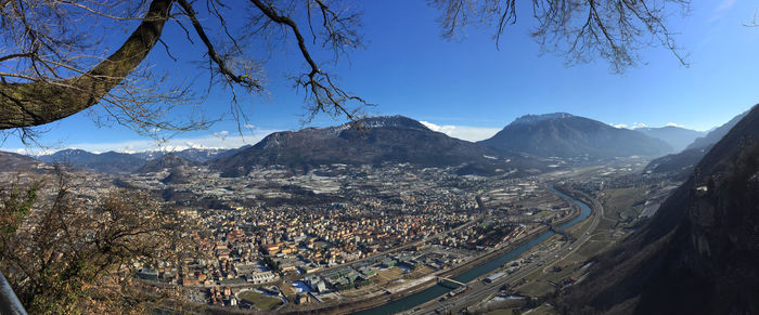 High angle view of city against blue sky