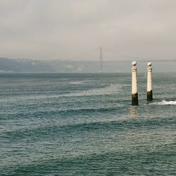 Sailboat in sea against sky