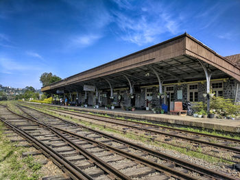  tracks by railroad station platform against sky