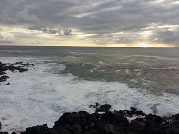 Scenic view of sea against dramatic sky