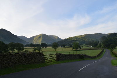 Scenic view of landscape and mountains against sky