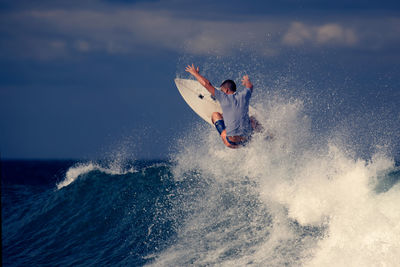 People surfing in sea