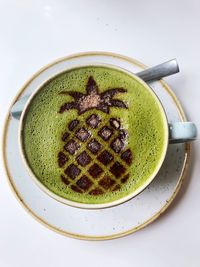 Directly above shot of coffee served with spoon