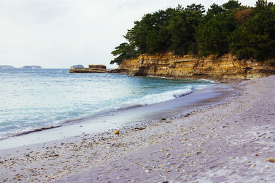 Scenic view of beach against sky