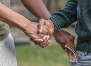 Close-up of man holding hands