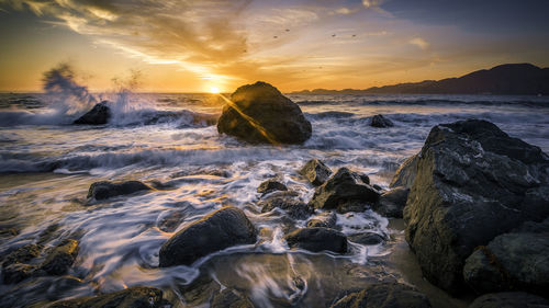 Scenic view of sea against sky during sunset