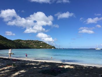 View of beach against cloudy sky