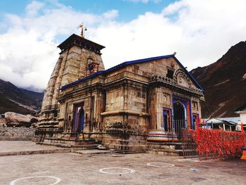 View of old building against cloudy sky