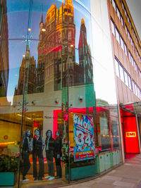 People walking in front of buildings