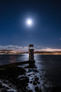 Scenic view of sea against sky at night