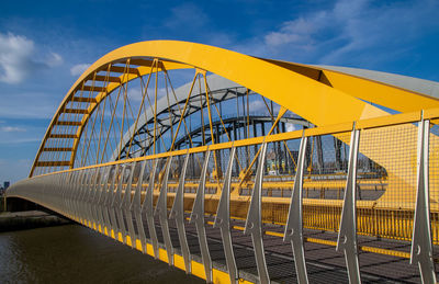 Yellow bridge hogeweidebrug between leidsche rijn en utrecht centre over the amstedam rijnkanaal