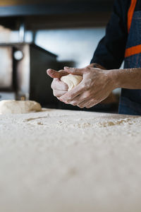 Midsection of person preparing food