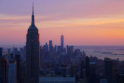 View of buildings in city during sunset