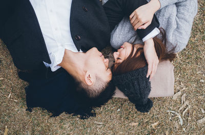 High angle view of man sitting on floor