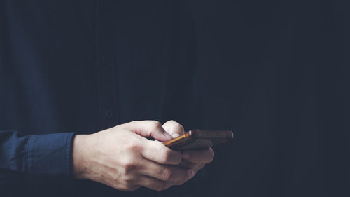 Social media technology concept, men's hands using smartphones to login social media,work from home 