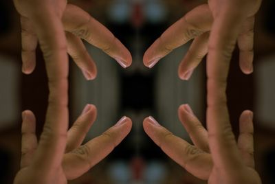 Close-up of human hand against black background