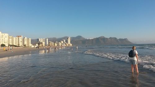 View of sea with people in background