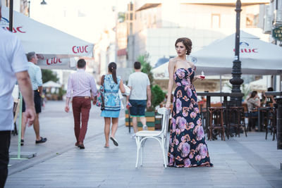 People walking on street in city