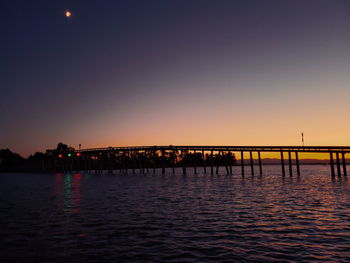 Scenic view of sea against clear sky during sunset