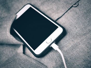 High angle view of smart phone on table