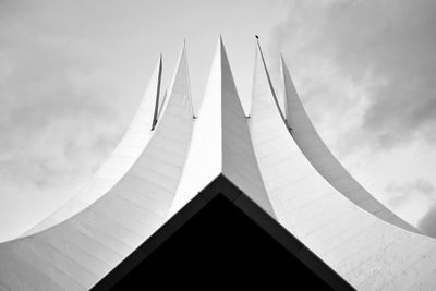 Low angle view of building against cloudy sky