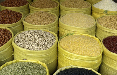 High angle view of legumes in sacks at market